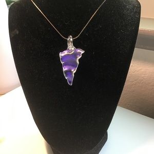 Artisan made glass pendant.